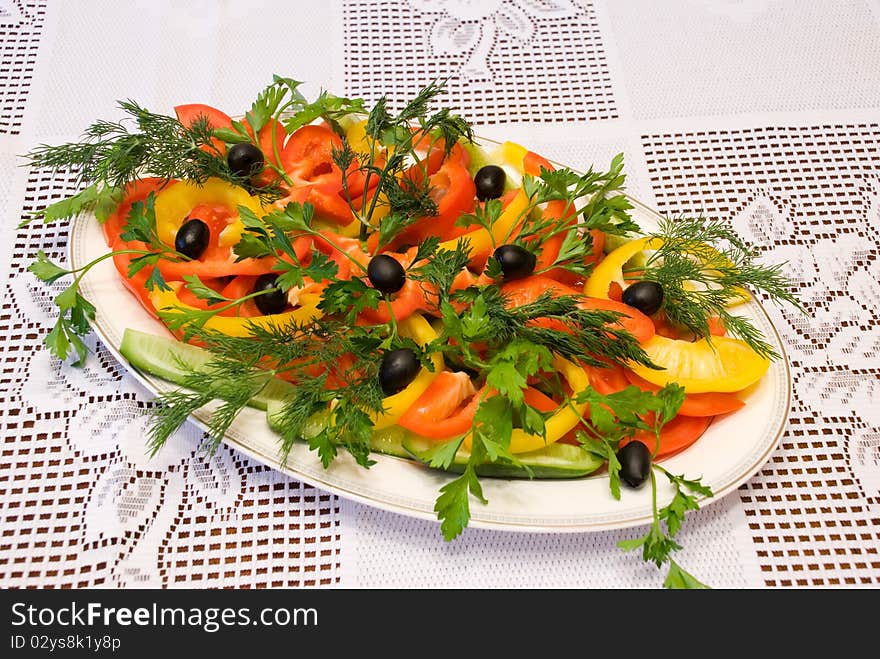 Photo of the cut vegetables lying on a white plate. Photo of the cut vegetables lying on a white plate