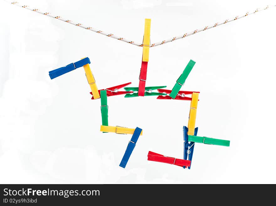 Colorful clothespins on a string