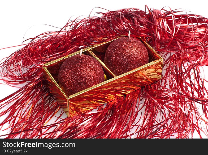 Red candles in a gold box