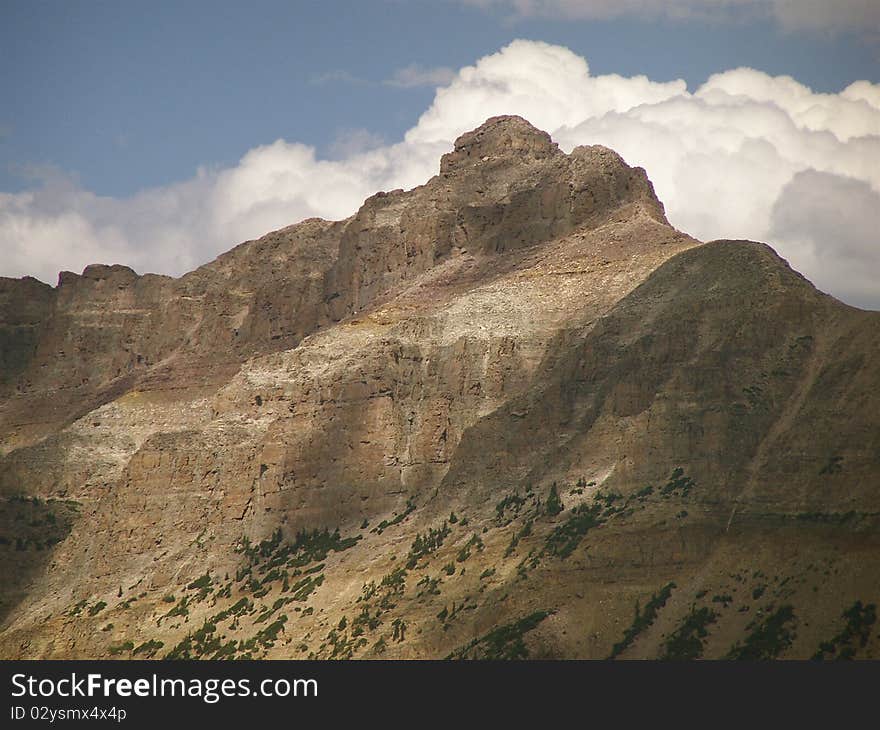 Hayden peak rises above Mirror lake. One of the thousands of small mountain lakes along Utah's scenic byway 150.