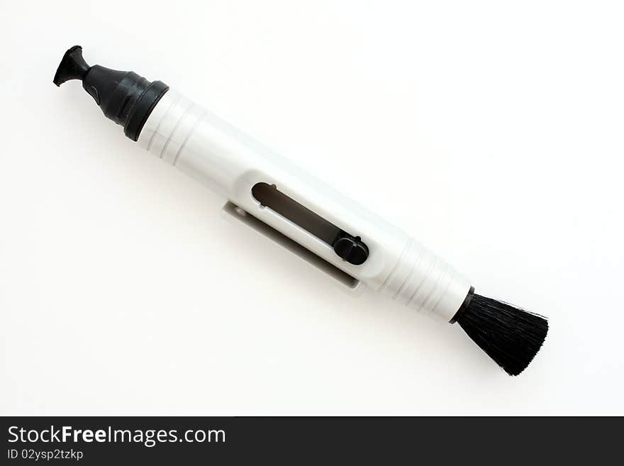 Lens pen for clean up your lens. On white paper. Lens pen for clean up your lens. On white paper.