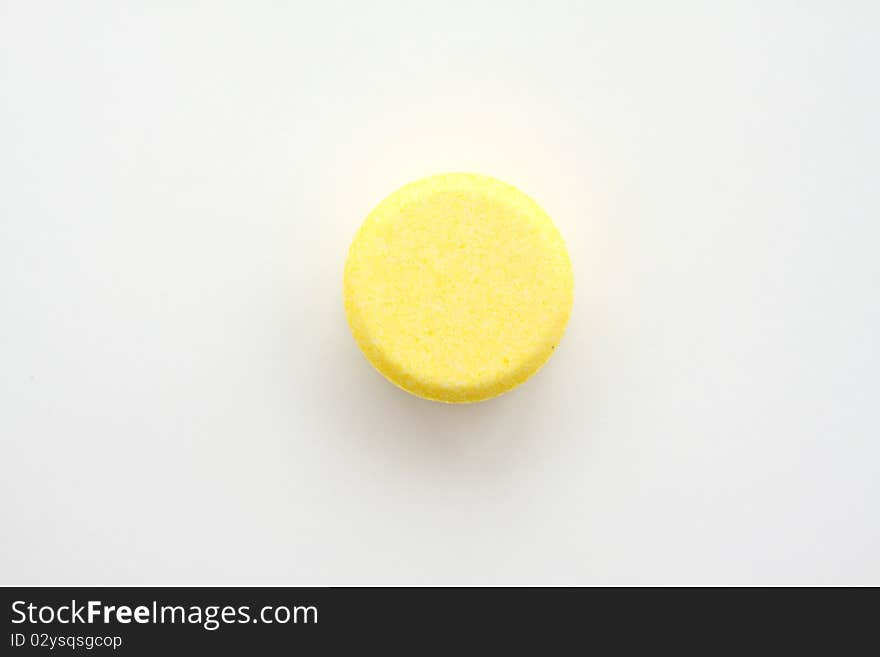 Yellow tablet for patient on white paper. Yellow tablet for patient on white paper.