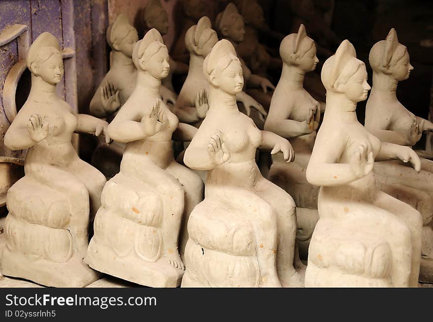 Rows of many clay idols kept for sale at a shop. Rows of many clay idols kept for sale at a shop