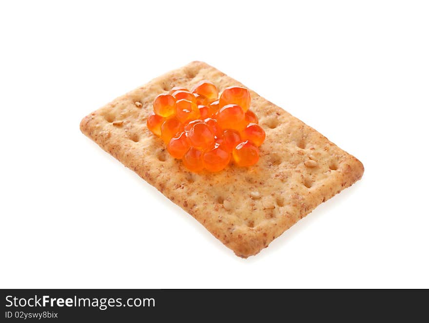 Cracker with red caviar isolated. Cracker with red caviar isolated