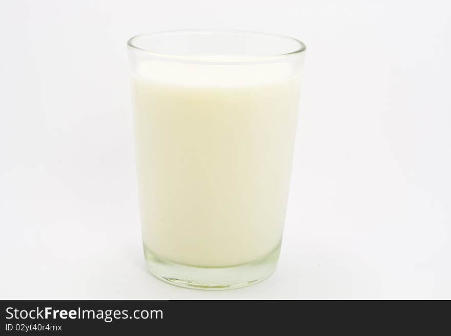 Creamy milk in a transparent glass