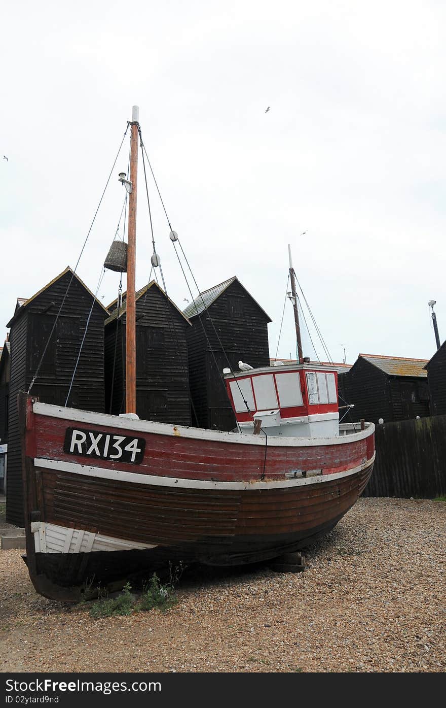 Fishing huts and boats on Hastings beach