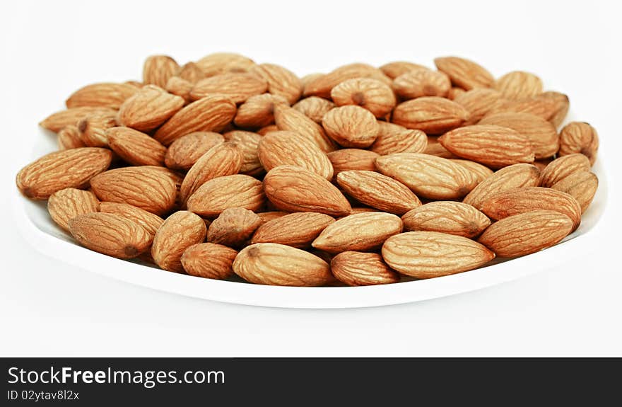 Ripe almonds on white background