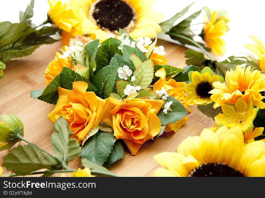 Bunch of flowers with sunflowers on wood board