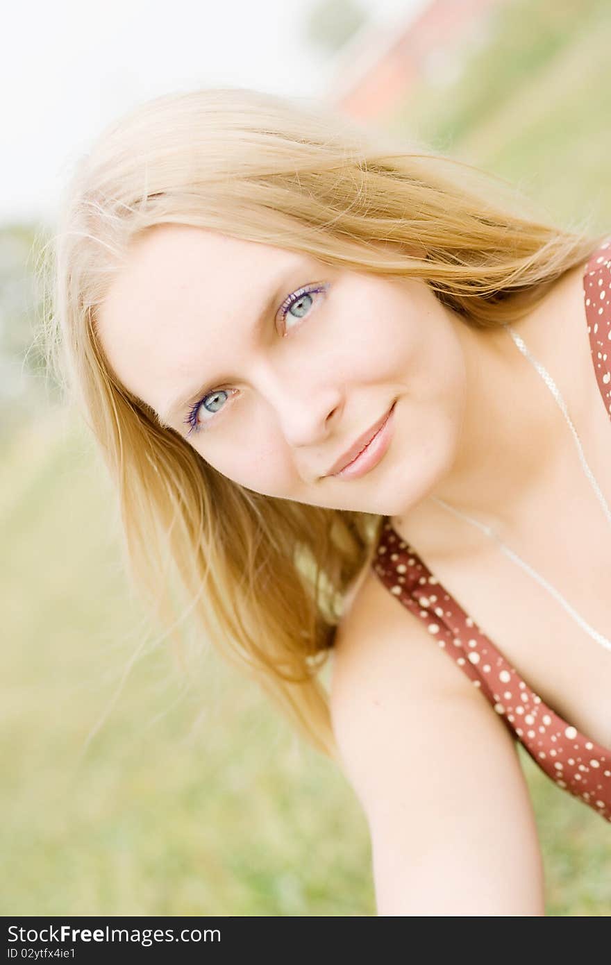 Summer portrait of the beautiful fair-haired girl