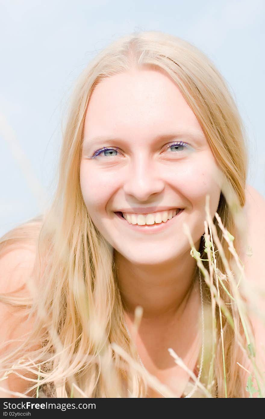 Summer portrait of the beautiful fair-haired girl