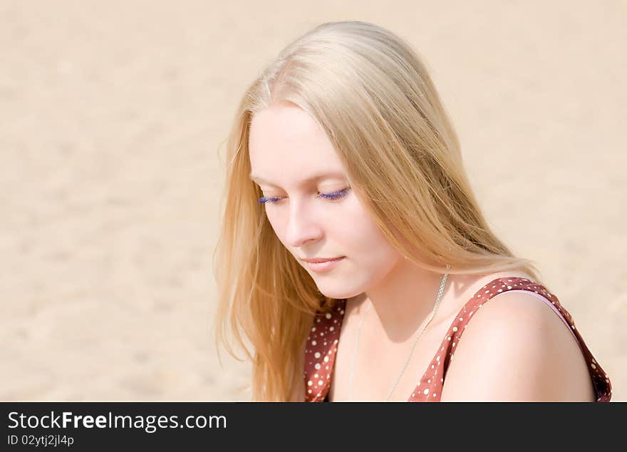 Summer portrait of the beautiful fair-haired girl