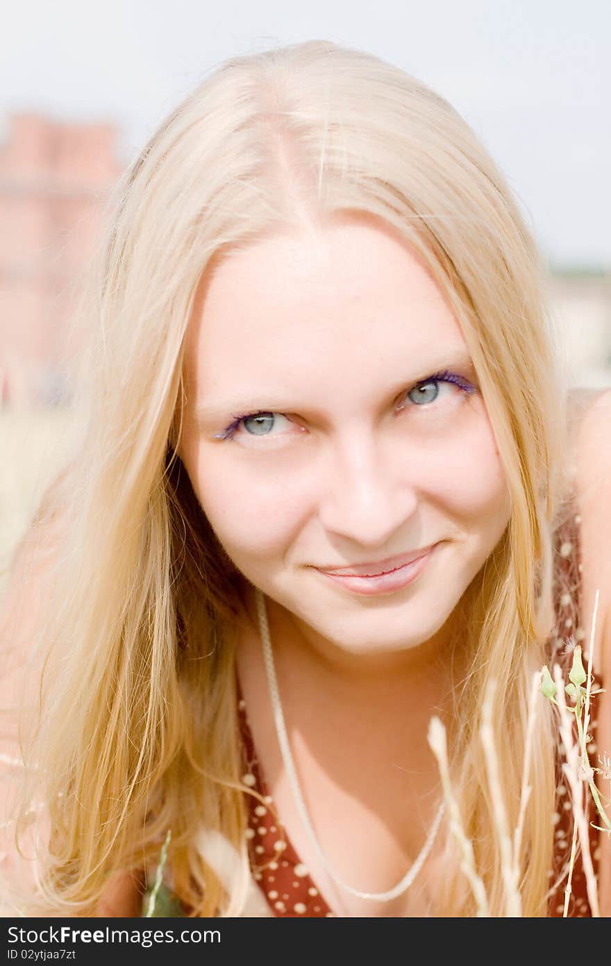 Summer portrait of the beautiful fair-haired girl