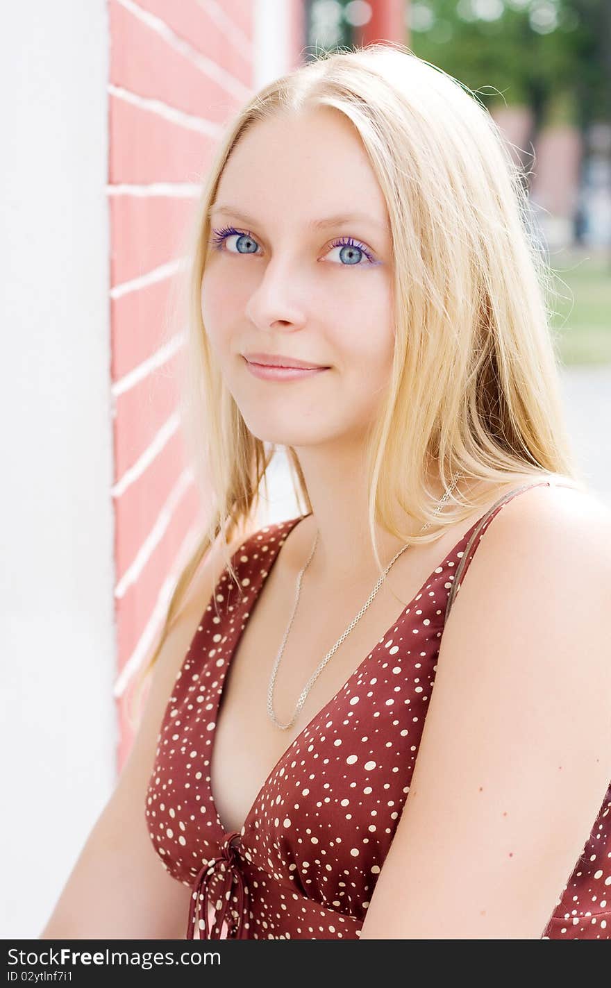 Summer portrait of the beautiful fair-haired girl