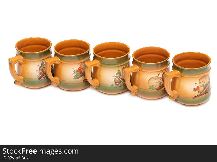 Five large ceramic mugs in red lined