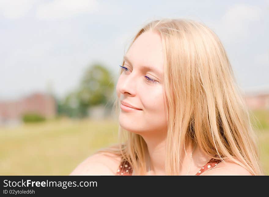 Summer portrait of the beautiful fair-haired girl