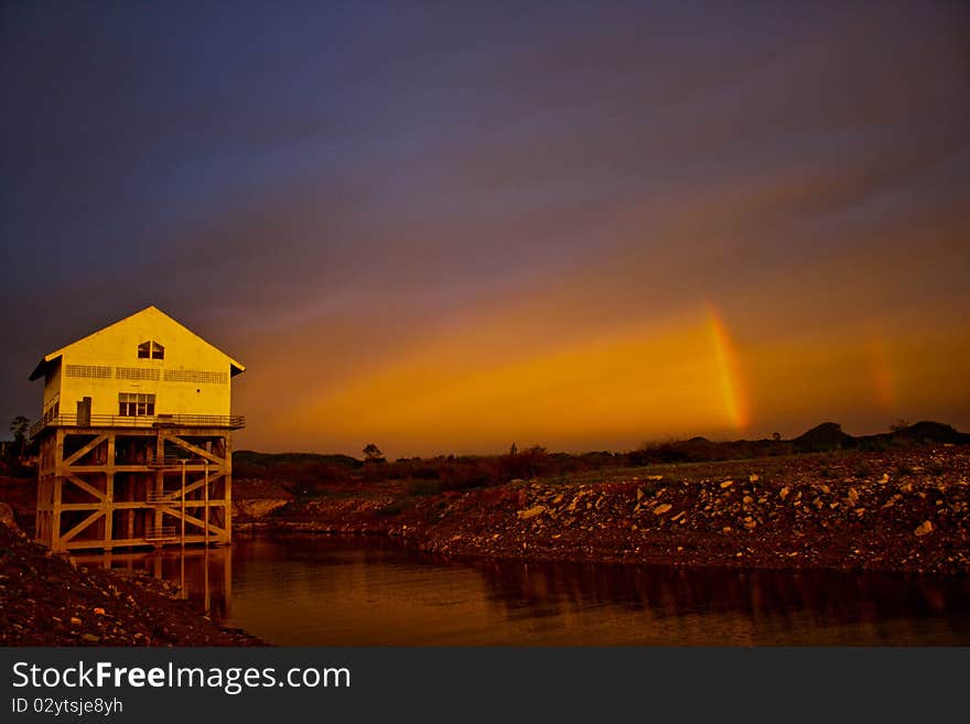 Rainbow over mountain and building. Rainbow over mountain and building