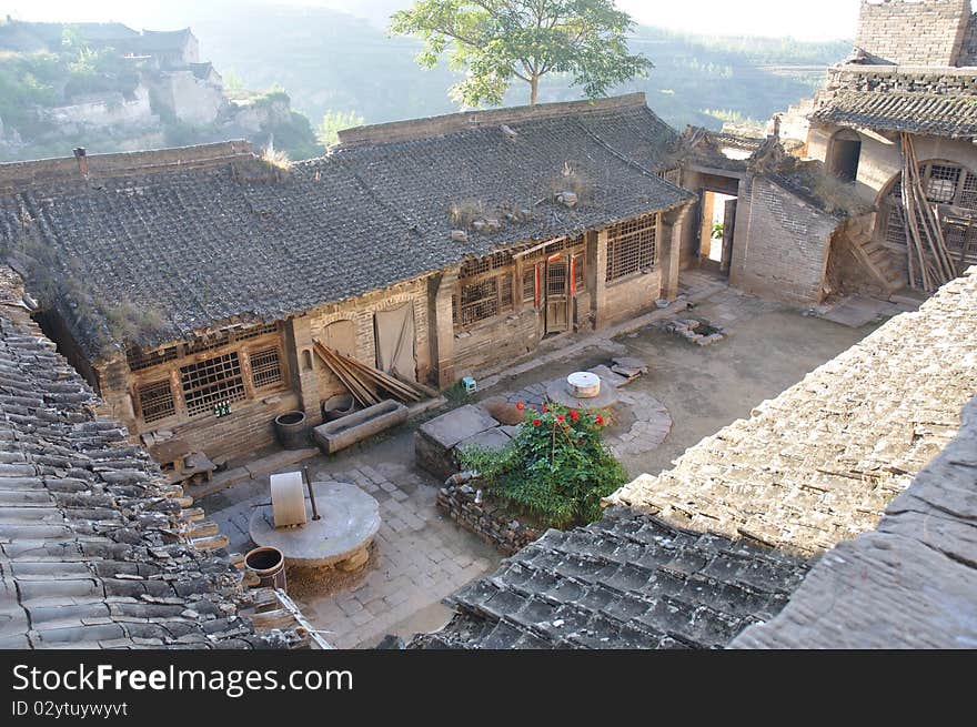 This is taken on top of mountain, there are some courtyard dismissed and the residence have moved to the new houses for convinence