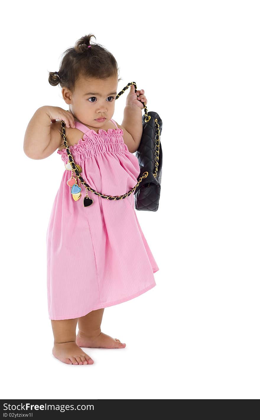 Cute little girl with purse, isolated on white background