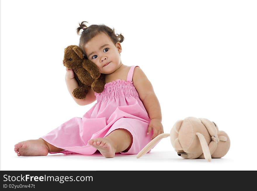 Cute little girl with teddy, isolated on white