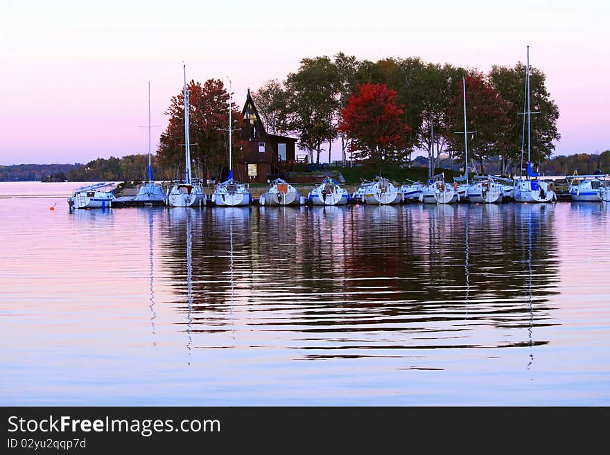 Peaceful sunset on the lake with reflection of trees. Peaceful sunset on the lake with reflection of trees