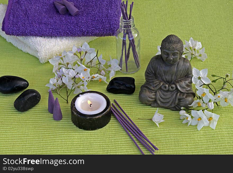 Buddha with jasmine flowers and incense