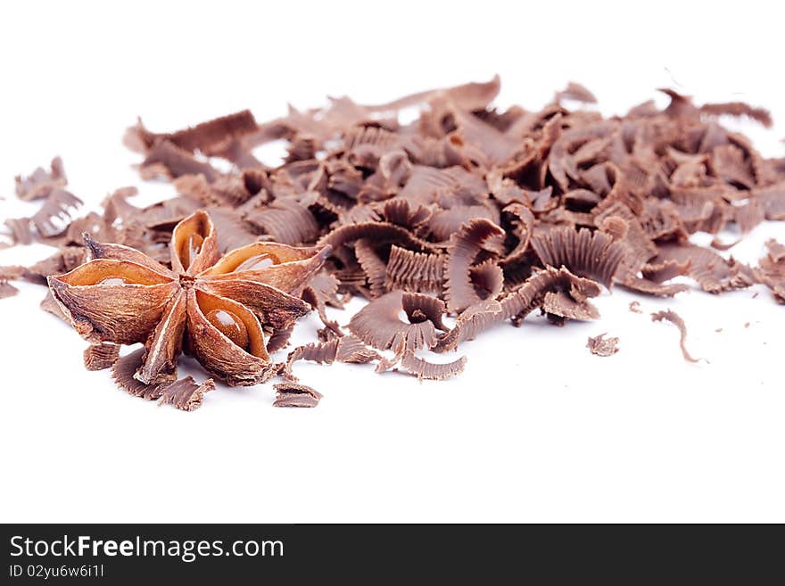 Bitter chocolate in a small crumb on a white background.