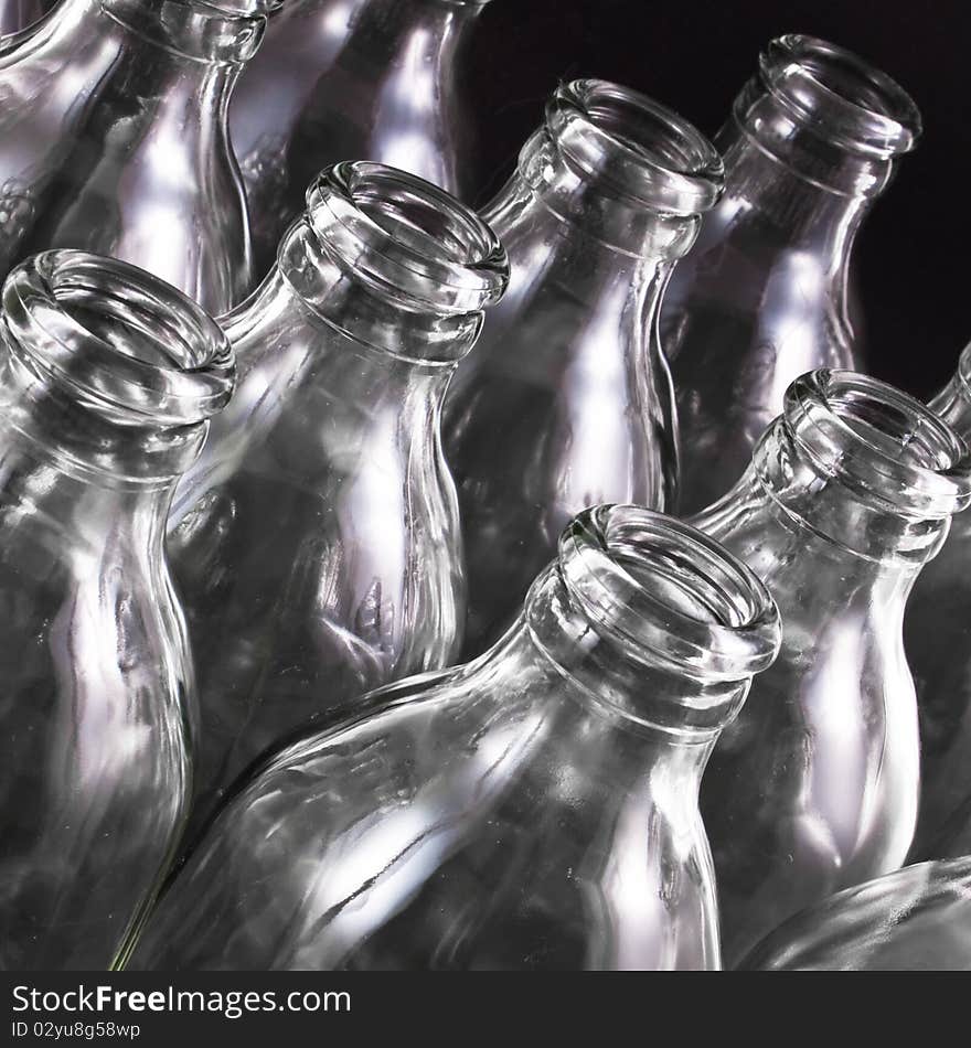 Empty bottles collection, colorless, isolated on black background