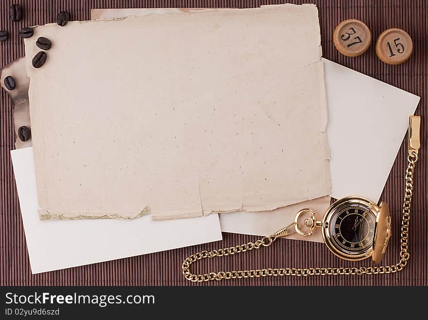 Old tattered sheets of paper on brown wood background for design creativity.