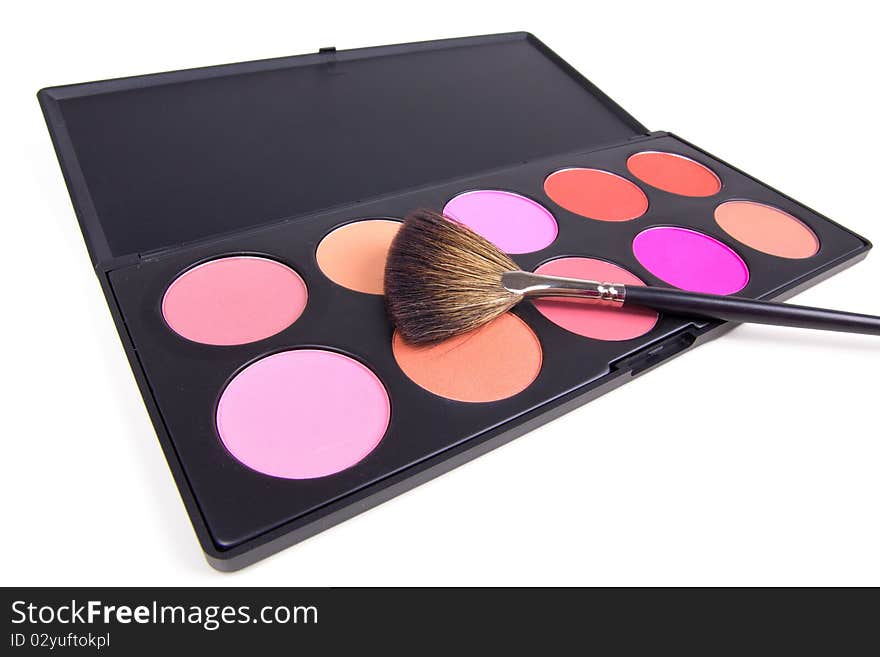 Professional make-up brush on eyeshadows palette, closed-up