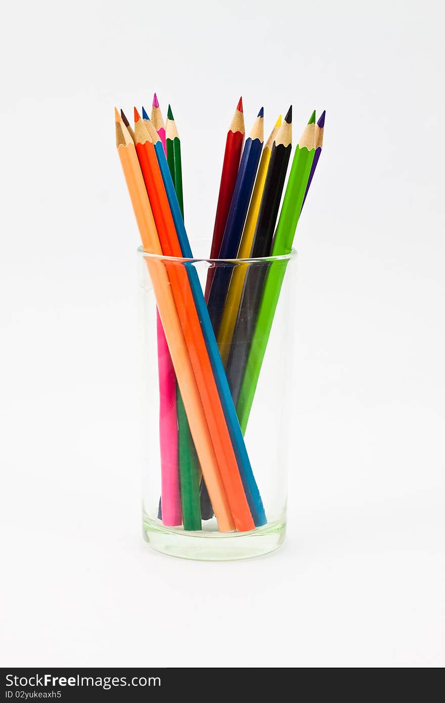 A clockwise standing pencils in a glass. A clockwise standing pencils in a glass