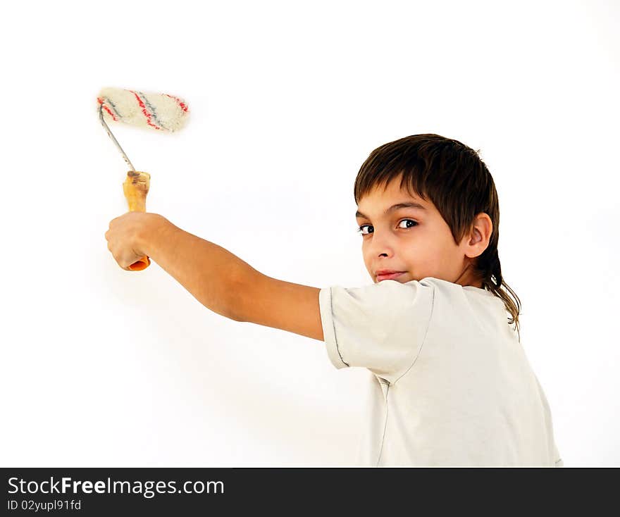 Teenage caucasian boy painting white wall indoor. Teenage caucasian boy painting white wall indoor