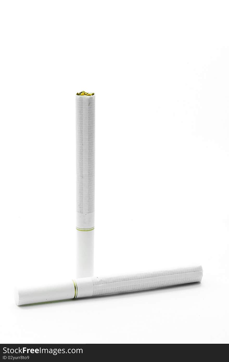 A pair of two white cigarettes with white filters on white background.