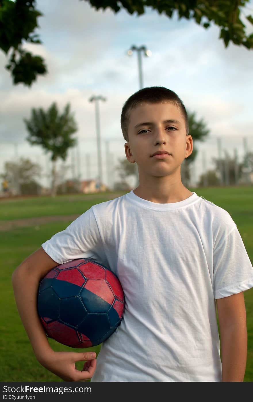 Boy With A Soccer Ball.