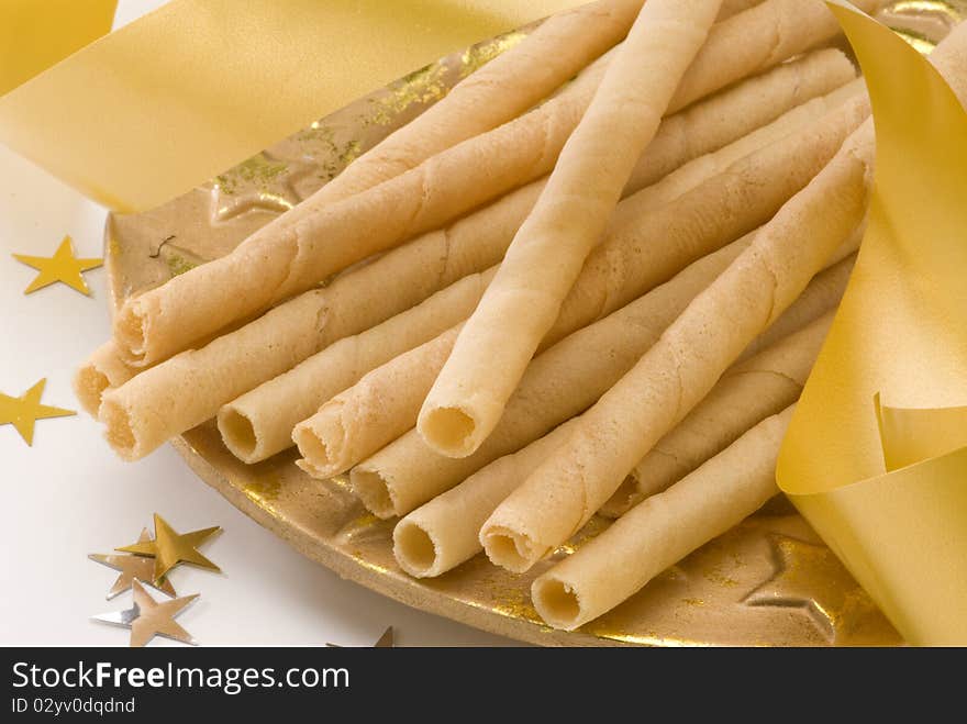 Traditional Spanish wafer rolls for Christmas named neules or barquillos. Traditional Spanish wafer rolls for Christmas named neules or barquillos.