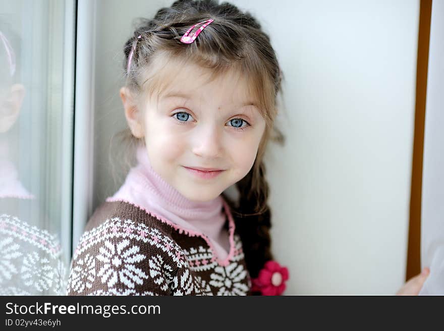 Beauty small girl with long dark braid