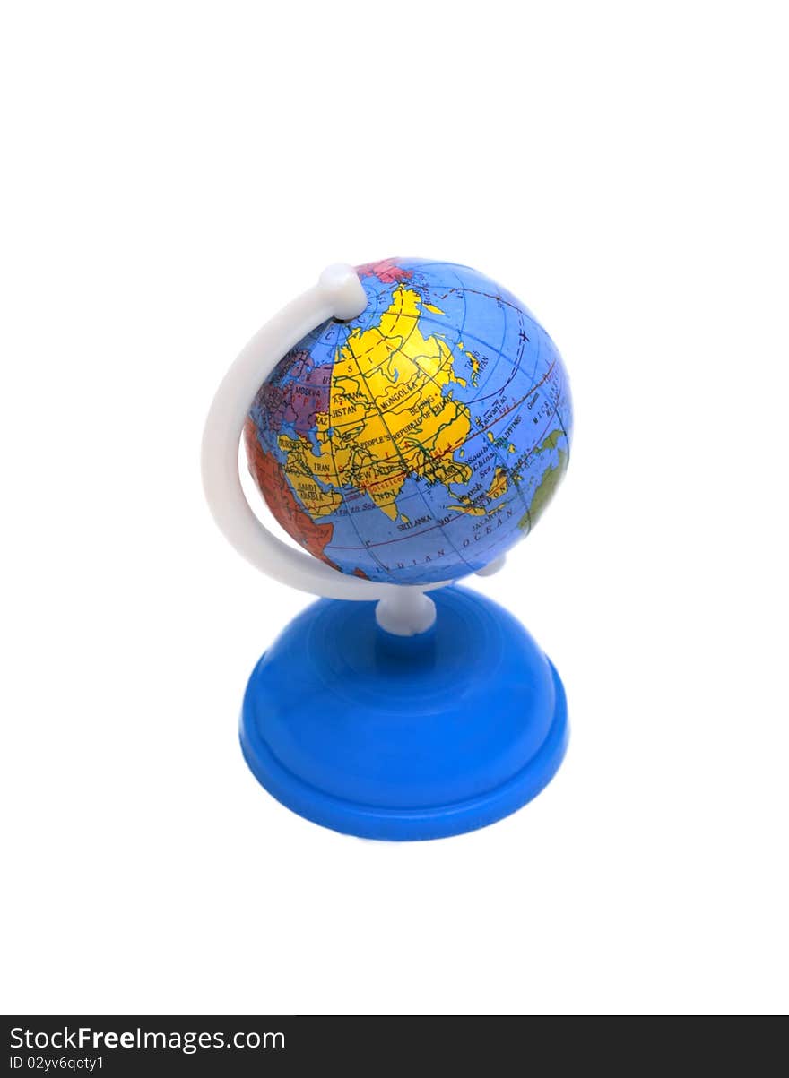 Small globe on a blue stand isolated on a white background. Small globe on a blue stand isolated on a white background