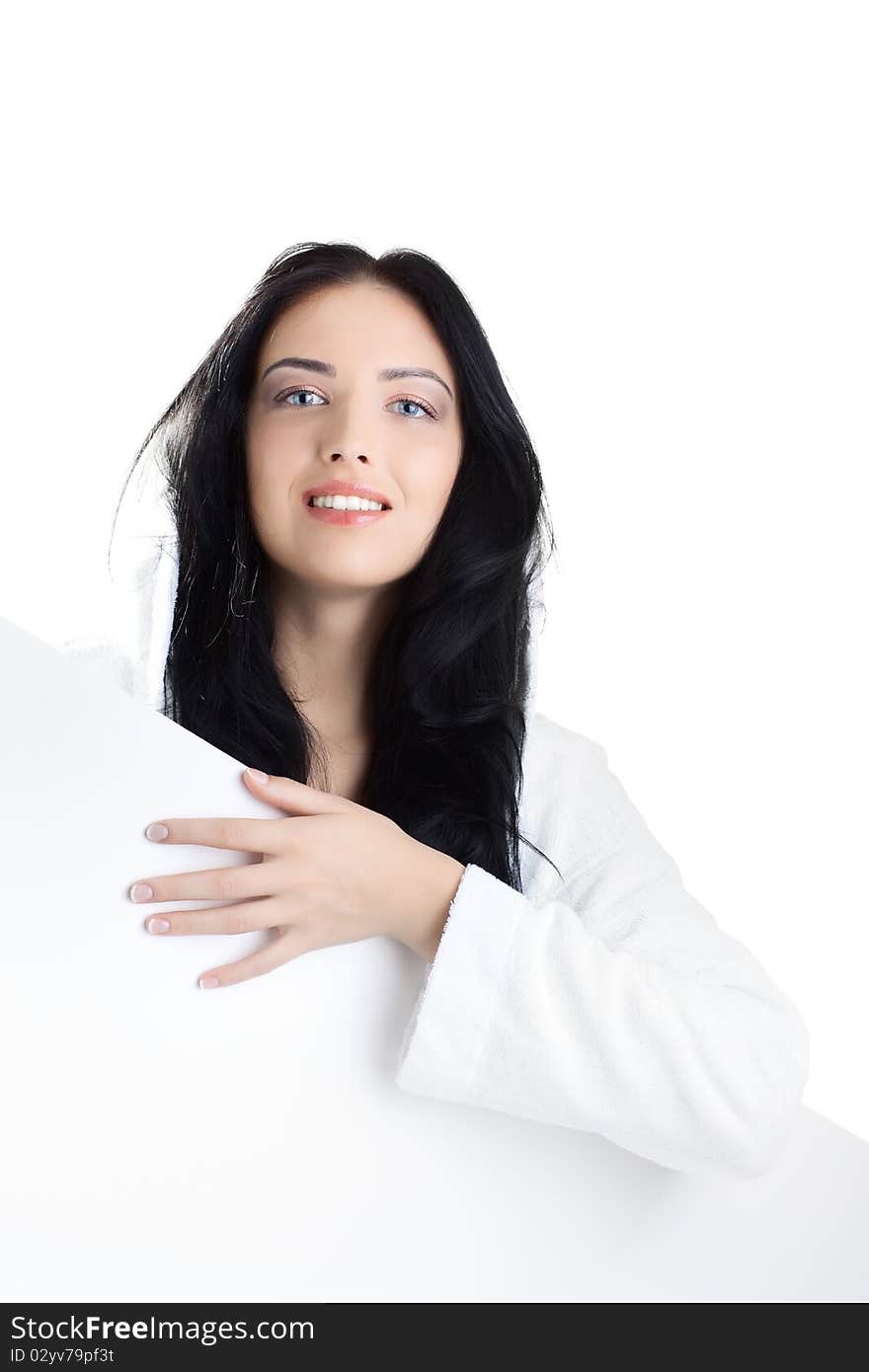 Beautiful woman in bathrobe over white background