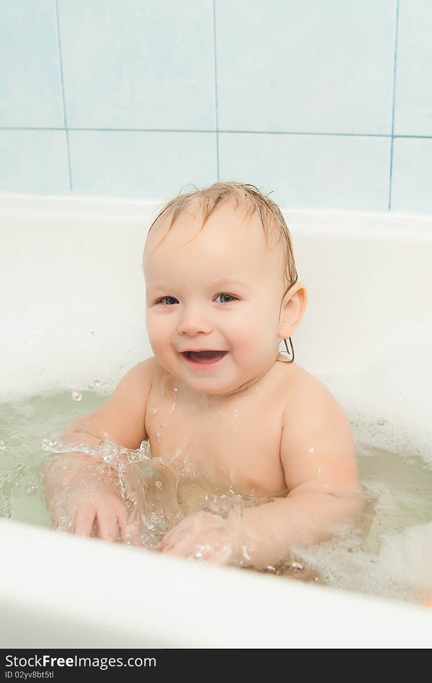 Cute Adorable Baby Clapping On Water In Foam Bath