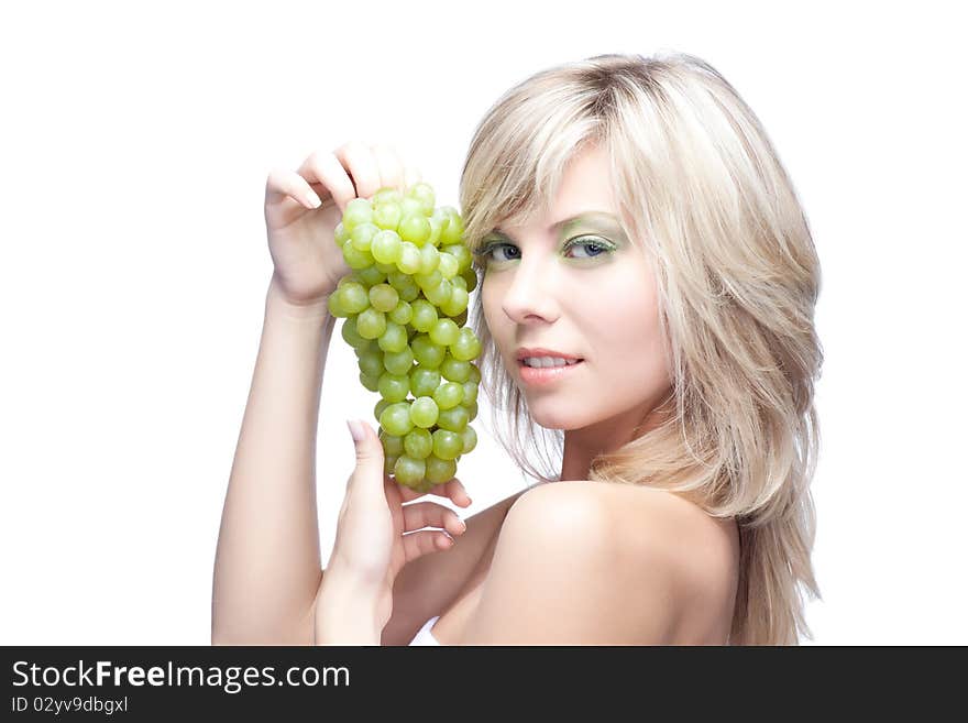 Beautiful woman over white background with grape. Beautiful woman over white background with grape