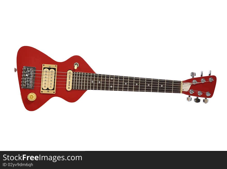 A grungy red travel electric guitar. A grungy red travel electric guitar