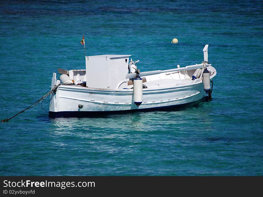 A traditional fishing boat off the coast of Formentera in the Balearic Islands.