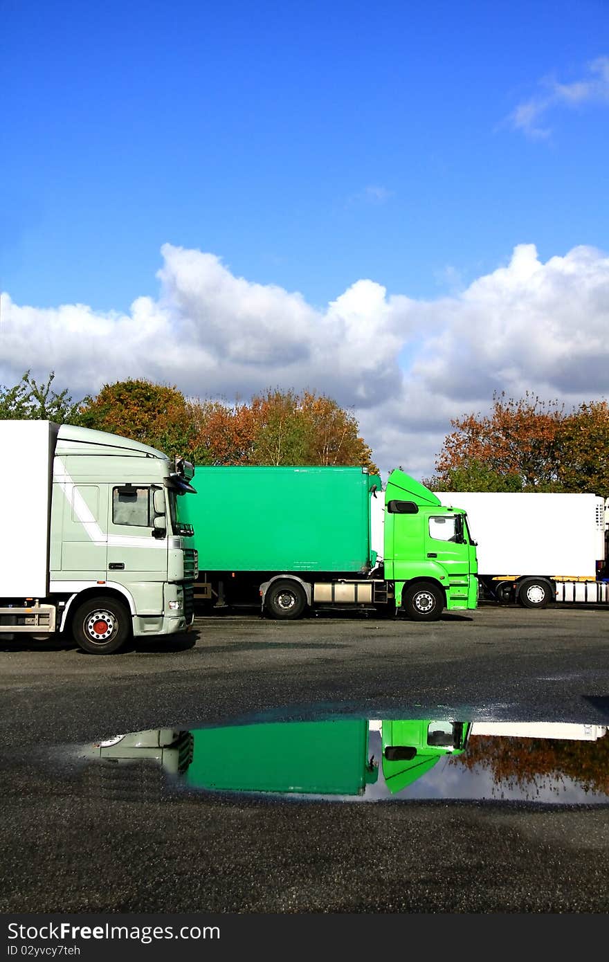 Image of a coaches parked outside a yard. Image of a coaches parked outside a yard