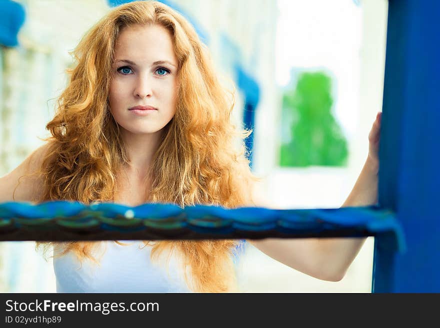 girl posing over old factory