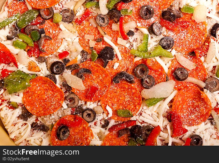 Raw Pizza With Vegetables And Pepperoni