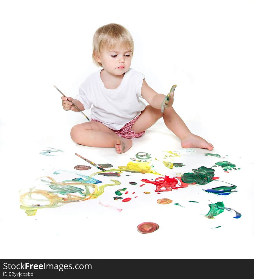 Cute child painting over white