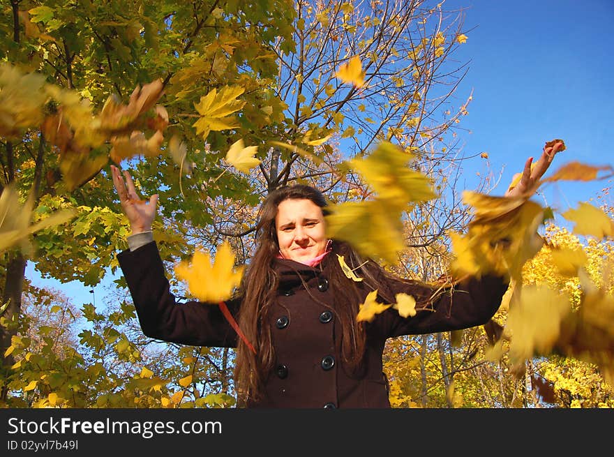 Girl And Falling Leaves