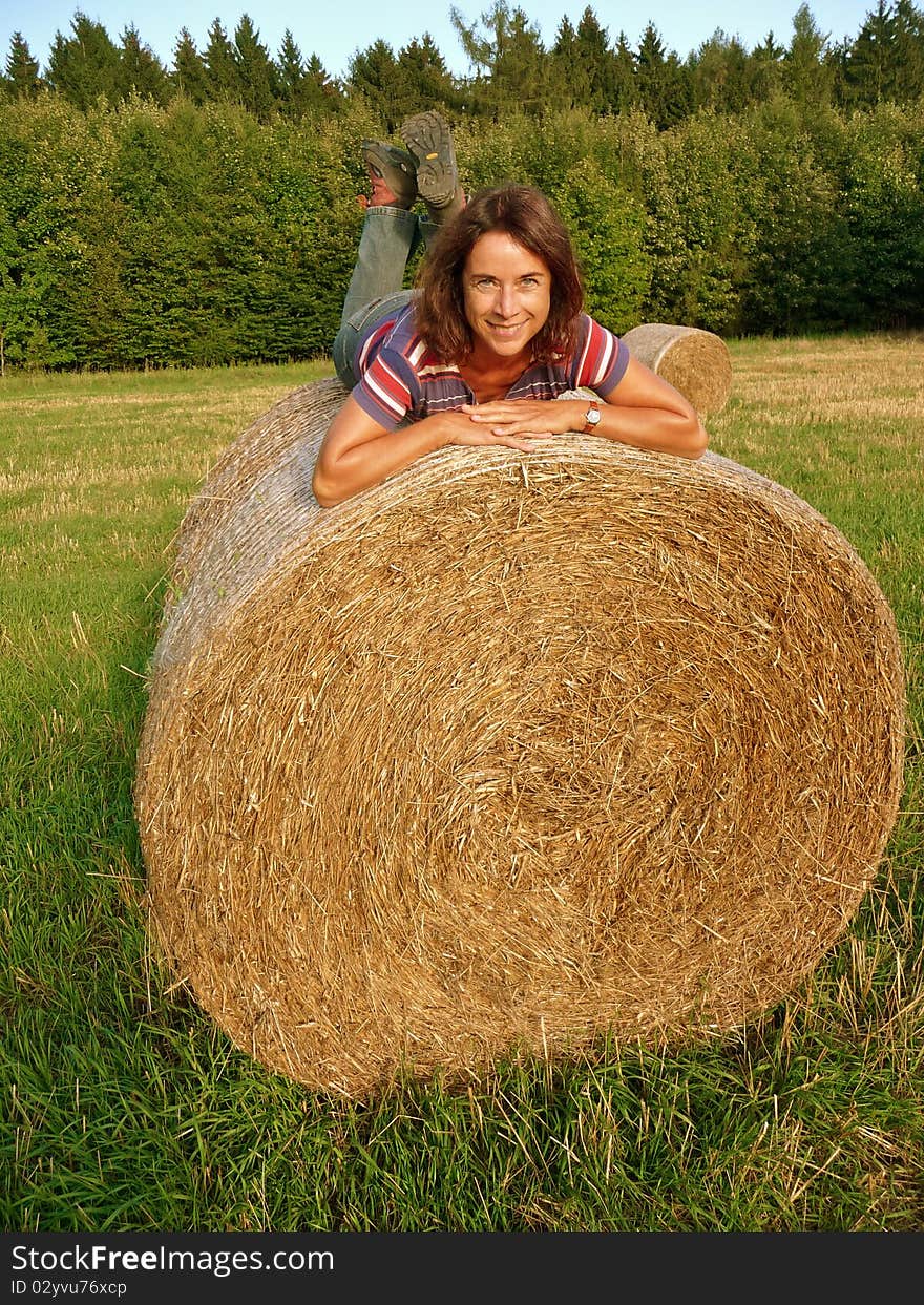 Happy Woman on Straw Bale