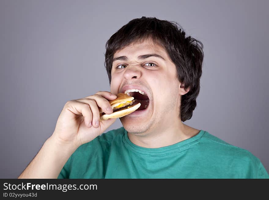 Cute Boy Eating Hamburger.