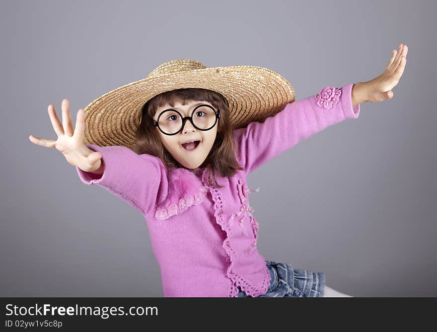 Funny girl in cap and glasses.