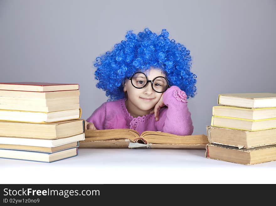 Young blue-haired girl with books.